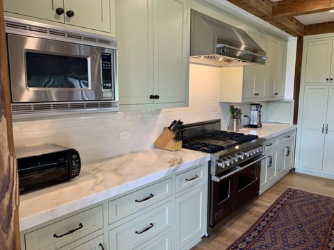 Kitchen with stove, microwave, toaster