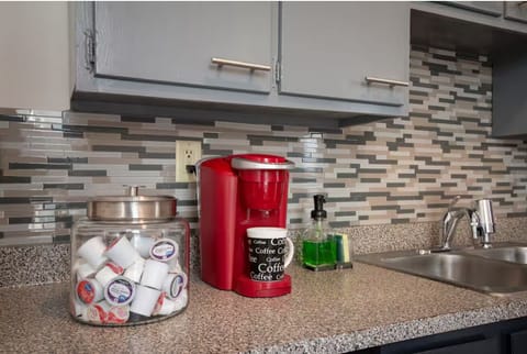 Keurig coffee maker with complimentary coffee pods and snacks!