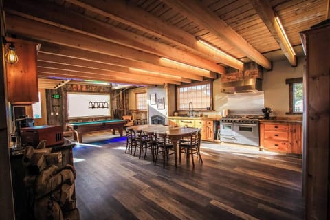 Come enjoy your lodge experience in the massive kitchen bar entertainment area. A real crowd favorite among our groups. Picture yourself here with music playing and the group having a blast playing pool by the fire making memories. 