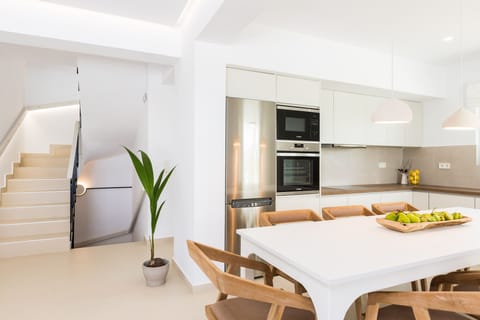 The living room area has direct access to a fully equipped kitchen!