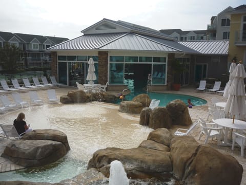 Outdoor part of indoor/outdoor pool nearest the bldg. Wading pool in foreground.