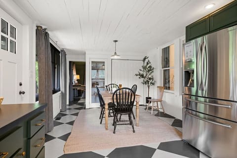 The heart of the home with room to move, laugh, and linger. Bonus points for that checkerboard floor—because functional can still be fun.