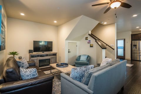 Living area opens to kitchen and dining. For additional sleeping there are two memory-foam tri-fold mats (with bedding linens).