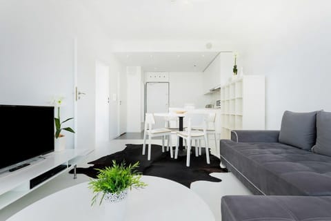 Living room with a comfortable sofa and TV. 