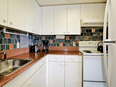 L-shaped kitchen is easy for guests to use.