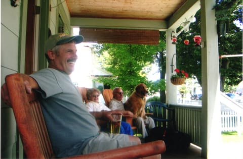 Jim Enjoying Front Porch with parents.