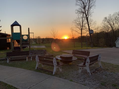Fire pit, playground, basketball areas.