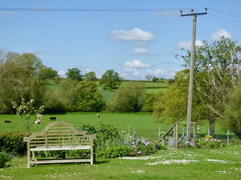 The fabulous view from rear garden over undulating meadow and farmland
