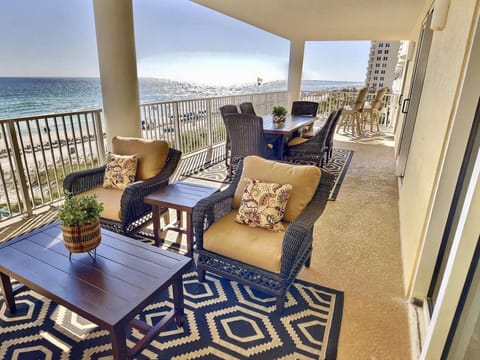 Spacious balcony deck overlooking the water and directly on the beach.