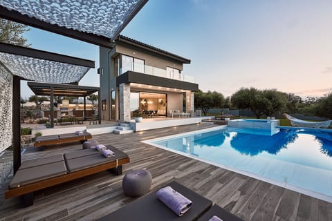 Carpos Villa features a beautiful outdoor area, offering total privacy.