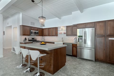 Fully equipped kitchen with large prep island and bar seating