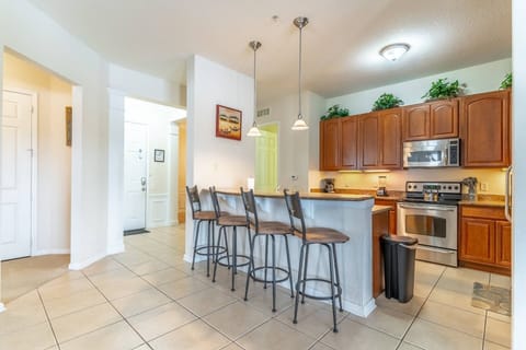 Main Entry Area, Breakfast Bar and Kitchen Area - Easy Access Throughout The Condo