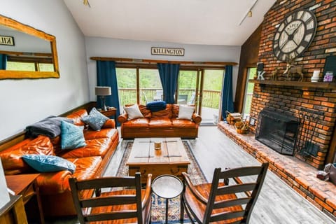 Living area features Ralph Lauren couches and high end chairs.