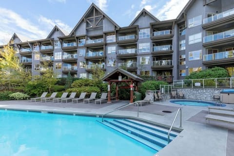 - Refresh with a dip in the heated outdoor pool surrounded by scenic mountain lodges  
- Unwind on poolside loungers after a day of exploring Whistler’s trails  
- Resort-style amenities designed for year-round mountain relaxation  
