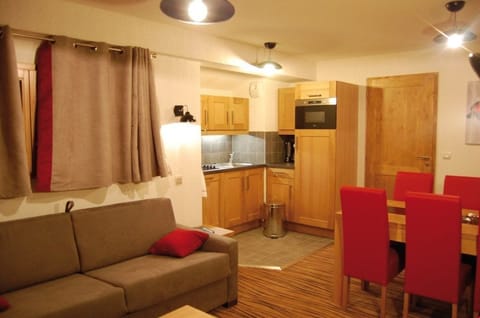 Prepare meals in the kitchenette and enjoy them at the dining table.