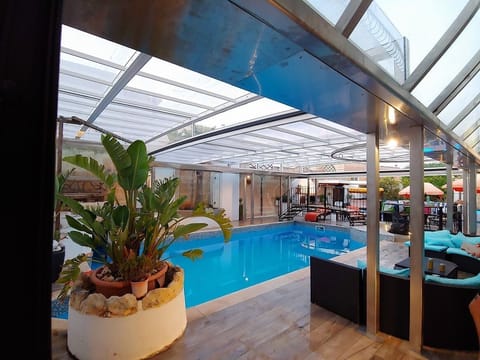 Retractable cover over heated pool and  deck area for our winter & autumn gue