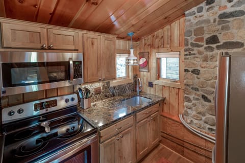 Kitchen with stainless steel appliances and granite countertops.