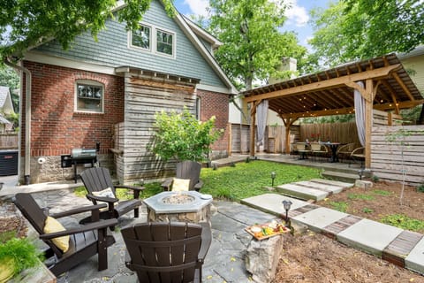 Backyard— gather around the fire pit or beneath the pergola