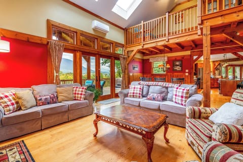 Living room as part of an open flow design.  French door to deck and hot tub