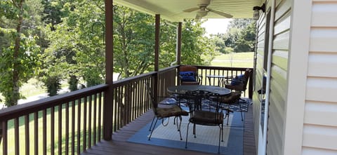 covered front porch. overlooks farm pond across the street