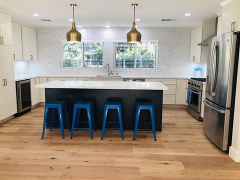 Counter seating in the large bright kitchen.