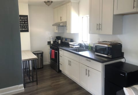 Kitchen with adjustable dining table