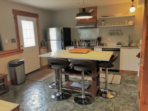 Kitchen island creates a great space for food prep, socializing and dining 