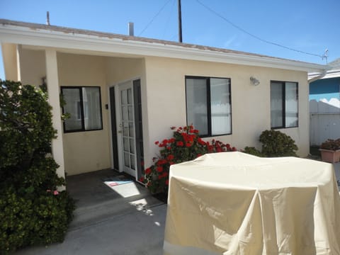 Cottage with covered patio table 