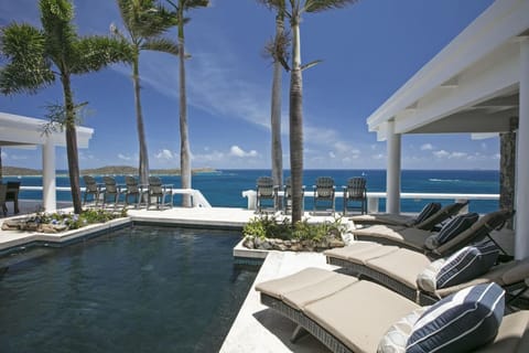 The upper pool with an amazing view, and sun loungers!