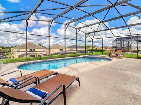 Relax in lounge chairs around the private pool & spa