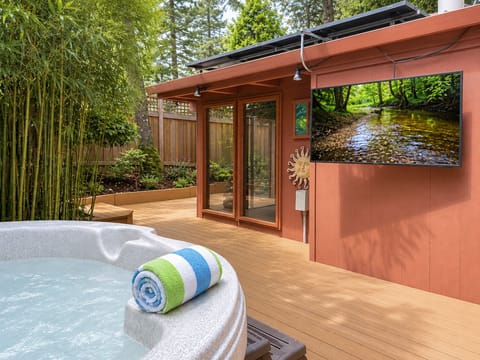 You can catch your favorite show while relaxing in the hot tub