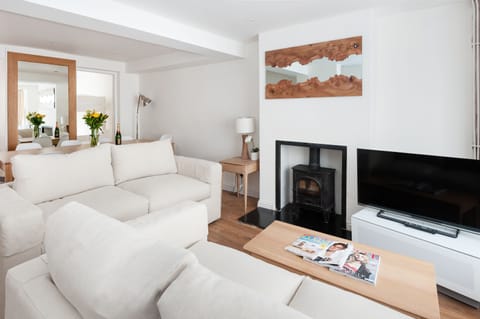 The living room which has two double sofa beds and leads to the dining area