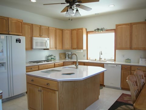 Kitchen is bright & light and fully appointed with appliances & cookware.