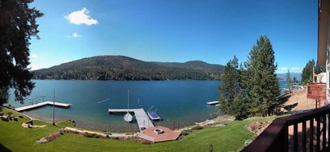 View of yard, fire pit, dock and Bottle Bay.