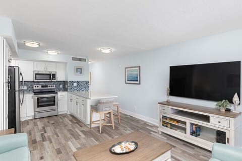 Fully equipped kitchen with brand new appliances and large island with breakfast bar style seating