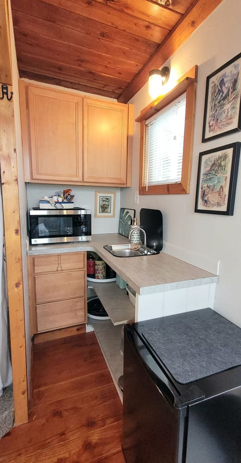 Updated kitchenette now includes a sink and microwave/convection/air fryer.