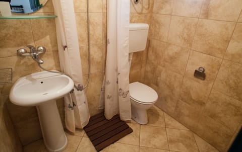 There is a shower in a private bathroom, as well as toiletries. 