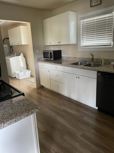 Kitchen area and entrance into the laundry room.