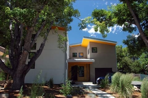 House from the front. Room is above the garage via outdoor stairs.
