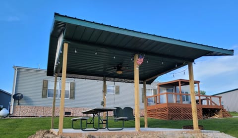Shelter, table, and swing added 5/13/22. Cement, fan & lights added on 6/20/22