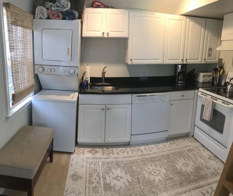 Kitchen with Washer/Dryer and Dishwasher. Full size stove