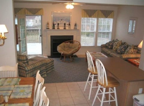 Family Room #1, center kitchen island, dining room & deck. Colorfully decorated!