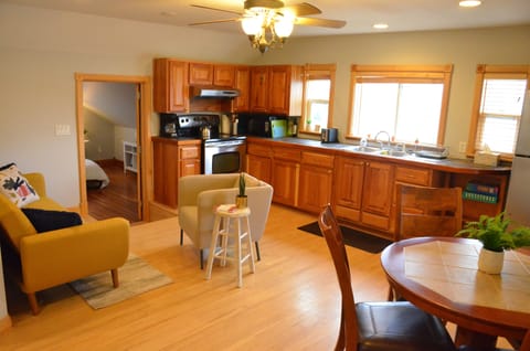 The main living space contains the kitchen, eating space, and TV/lounge area