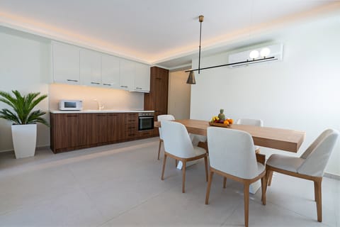 Fully equipped kitchen with wine cooler.