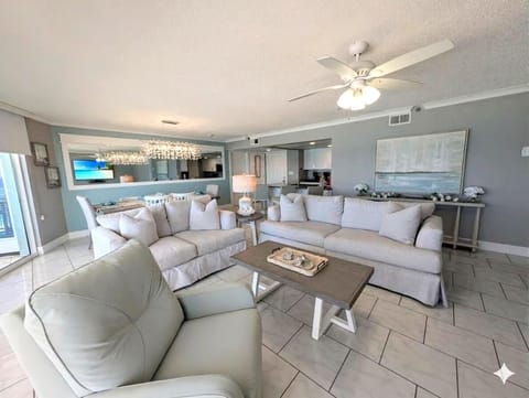 Spacious living room with cozy seating and ocean views