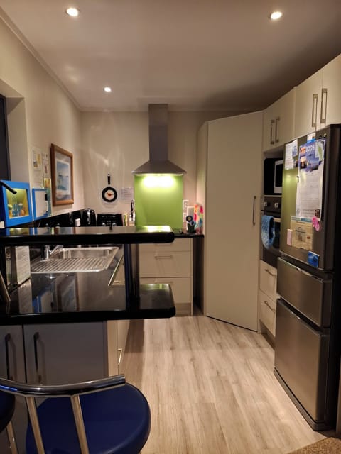 Full kitchen, cooktop, oven, microwave, full size fridge/freezer with icemaker..
