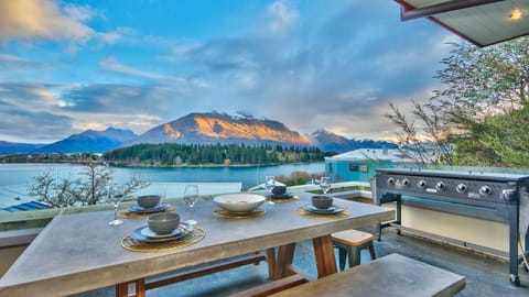 Outdoor dining area with BBQ and stunning views