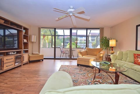 Living room opens up to screened large screened lanai