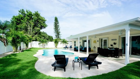 Big backyard with plenty of seating for the entire family with a heated, salt water pool.