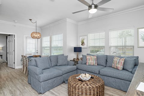 Relax in your bright, airy living space featuring plush sectional seating and coastal charm that makes you feel instantly at home.
